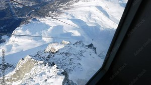Steep snowy mountain peaks cable car view in Chamonix France