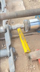 This appears to be a track pin press machine, used for heavy construction machinery maintenance.