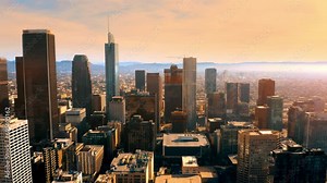Aerial of downtown Los Angeles in dawn, sunset in California, skyscrapers and office buildings. Cinematic urban aerial time lapse of downtown Los Angeles skyline.