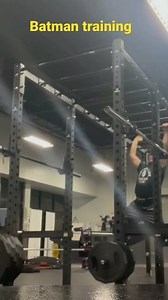 Batman training on pull up bar