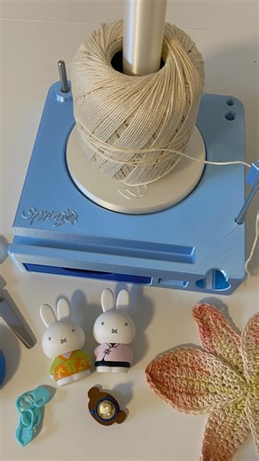 the.knotical on Instagram: "Tools you need if you crochet or knit!! The yarn spinner by @springsfantasy makes knitting/crochet sooo much easier🥹 I can’t tell you how many times my ball of yarn would roll away from me This one is portable so you know I’m bringing it with me to every outing💖"