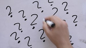 clip-1090576153-drawing-question-marks-on-whiteboard