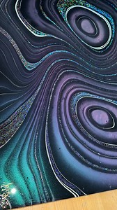 Sunlight shows off color shifting paints and holographic glitter best when the artwork is sealed with resin! The glossy, mirror like finish makes the effects pop, though it can be tricky to film without glare. The shift is best captured outside under natural light! 🤩🌞 Galaxy Pour Painting. 16x20” canvas. #foziacreations #colorshift #holographic #glitter #abstractart #galaxy #contemporaryart #artwork #resin #pourpainting #acrylicpouring #foryou | Fozia Creations