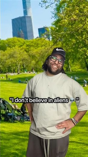 Look there is a alien on a tree