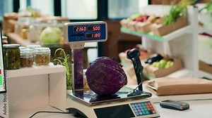 Electronic scale in zero waste eco store used to weight organic produce created without industrial solvents or synthetic food additives. Weighing machine in local grocery supermarket.