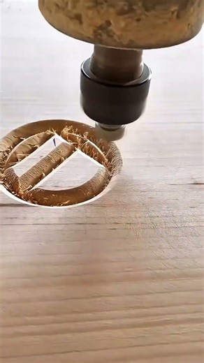 Precision carving with a high speed cnc router to create intricate circular designs on wooden surfac