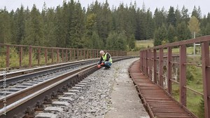 Railway engineer checks the railway line. Inspection and control of railway tracks is carried out by the engineer. Work on railway. Engineer walking and check track work on railways