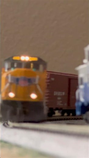 N scale UP train rounds a curve