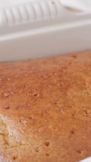 Bold Bakers, this South African Malva Pudding is super moist, sweet, and flavored with apricot jam and lovely caramel notes! It's especially popular during the holidays, but once you taste it and see just how easy it is to make, you'll be making it year-round! https://www.biggerbolderbaking.com/south-african-malva-pudding-recipe/ | Bigger Bolder Baking