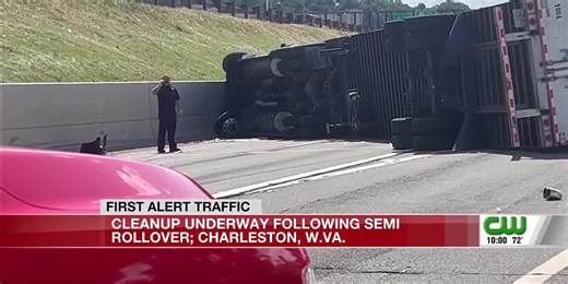 Tractor-trailer rollover crash closes I-64 West
