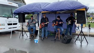 The DBI Band performs for tailgating fans outside Milan Puskar Stadium. | The Exponent Telegram