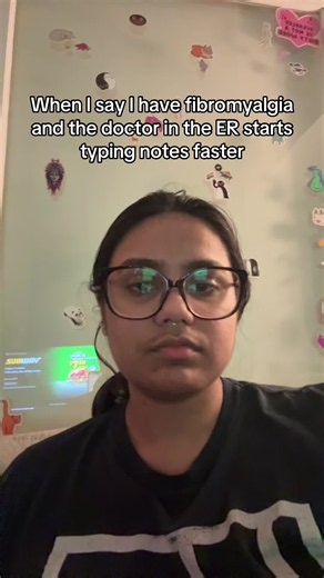 And this is why I won’t mention it right away now because they just immediately show their bias (obvi not true for all ER docs but more often than not) #Fibromyalgia #MedicalBias #MedicalGaslighting #ChronicIllness #ChronicPain [Video description: Anna is a brown non-binary person with dark brown hair tied back and big, black framed glasses. The text on screen says, “When I say I have fibromyalgia and the doctor in the ER starts typing notes faster.” The audio is a man saying, “what did you just