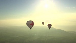 What a way to start the day ☀️☀️☀️ Our reporter Fiona Lamdin is taking part in a world record bid this morning. More than 80 balloons are trying to cross the Channel after taking off from Dover earlier. | BBC Breakfast