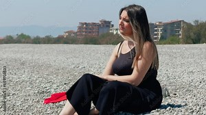 Woman At The Beach Throwing Rocks