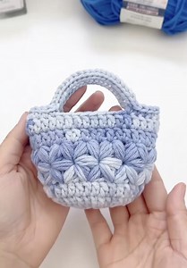 Learn how to crochet a cute and practical mini bag that works as an earphone pouch or small handheld bag. This beginner-friendly step-by-step tutorial uses simple stitches and a beautiful puff pattern, perfect for gifts, selling, or daily use. #CrochetTutorial #MiniBagCrochet #BeginnerCrochet #HandmadeBag #CrochetIdeas | Jonalyn B. Mangunay