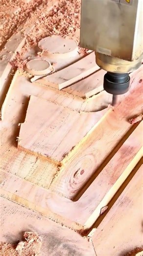 carving intricate curved patterns into a thick wooden board using a precise automated cnc machine