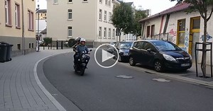 This Guy Playing Trombone on the Back of a Scooter Sounds Like He’s Going 200 mph