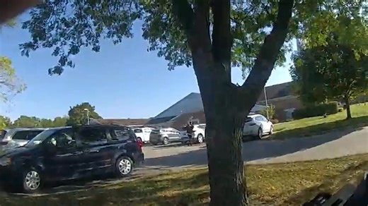 Body camera video from the Grand Blanc Township church shooting shows law enforcement officers racing toward the scene and the assailant, minutes after someone made the first call for help to emergency dispatch during the mass shooting and fire that left four churchgoers dead. The 47 seconds of video from a Grand Blanc Township officer's body camera was shown to members of the media during a news conference Friday, Oct. 3. In the video, the officers approach the scene when a barrage of what Gran