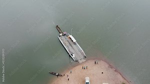 Aerial, Docked Barge Attached to Canoe Floating on Afram River Ghana Africa