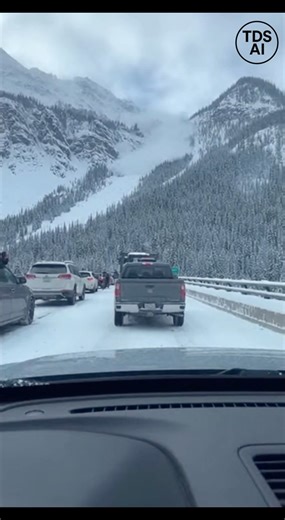 Dashcam Captures Avalanche Crashing Down Colorado Mountains as Pedestrians Run for Safety Dashcam footage recorded in Colorado shows a dramatic and dangerous scene as an avalanche crashes down a snow-covered mountainside toward a bridge where vehicles are stopped. The video captures traffic stalled on the bridge when a sudden wall of snow and debris breaks loose, racing downhill toward the roadway. As the avalanche approaches, pedestrians who had exited their vehicles can be seen running for saf