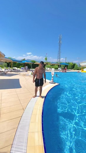 Young Man's Epic Pool Jump on a Sunny Day
