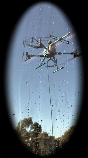 Flying Clean Drone Washes Tower Windows