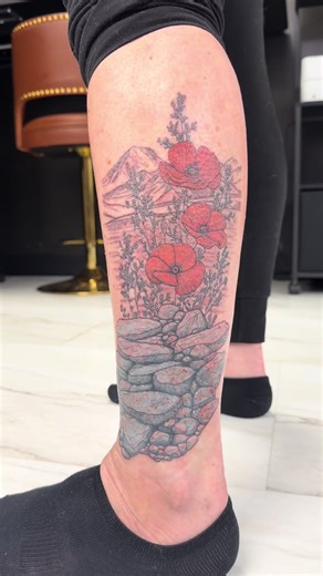 Spent the day with Casey, doing a triple coverup, she originally had writing that was covered with the blue roses, then we utilized the rocks to coverup both; while adding the distant mountains and poppies to create a new focal point and some bright lights hues. #northdakota #coveruptattoo #floraltattoo #legtattoo