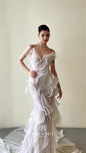 𝕳𝖆𝖈𝖈𝖍𝖎𝖈 𝕮𝖔𝖚𝖙𝖚𝖗𝖊 on Instagram: "The iconic 3D floral technique of Hacchic Couture — where every petal is handcrafted with precision, layered to create natural movement, and embellished with delicate crystals for a lifelike bloom #HacchicCouture #LunarFracture #SS26 #HauteCouture #LuxuryFashion #CoutureCraftsmanship #Handcrafted #FloralEmbellishment #EtherealElegance #FluidSilhouette #HacchicSignature"