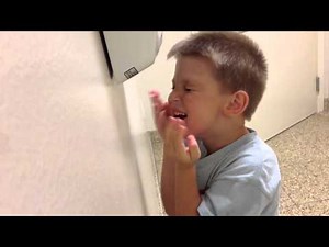 Baby with the hand dryer