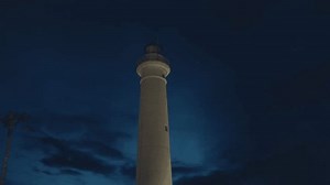 Flashing Lighthouse in the night tower