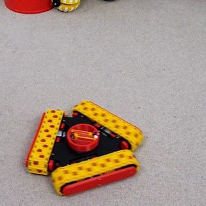 I’ve previously built various omnidirectional vehicles. Those included a machine I built to promote a LEGO set, which used three standard omni-directional wheels. We’ll talk more about the maths involved in calculating the wheel velocities later in this video, but using a combination of wheel velocities the machine was able to move in any direction as well as rotate. Neither of these vehicles where particularly good at climbing over objects though. I built various other projects which were much 