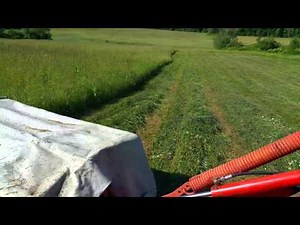 John Deere mowing hay Kuhn disc mower