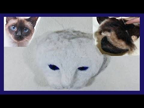 A 3D needle felted Cats head Painting. The Siamese cat