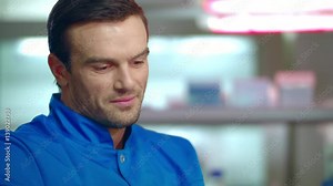 Male doctor thinking in lab. Close up of lab doctor portrait. Portrait of scientist man in lab. Lab worker portrait. Thoughtful man scientist. Chemist thinking. Scientist thinking in laboratory