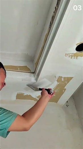 Smoothing joint compound into ceiling corner carefully