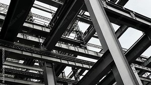A low-angle view of a steel framework, showcasing the complex and intricate construction