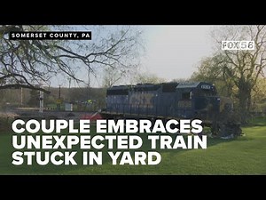 PA residents embrace unexpected train stuck in lawn as CSX prepares for removal