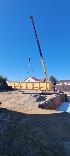 Construction Workers Using Heavy Machinery in Action