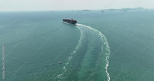 container ship sailing full speed in sea import export goods and distributing products to dealer and consumers of international by container ship Transport business service 4k video motion from drone,