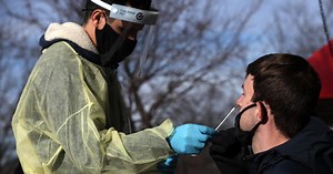 Omicron spike sparks surge in COVID testing