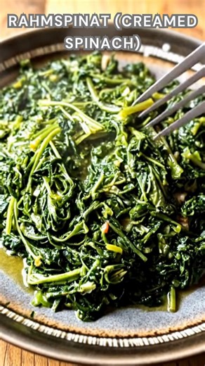 Spinach sautéed with onion, garlic, and butter. Stir in cream and nutmeg. Simmer for 10 minutes until thick, velvety, and rich classic German Rahmspinat, creamy comfort in every spoonful. ➤ Ingredients 1 lb fresh spinach, washed 1 small onion, diced 1 cup heavy cream 2 tbsp butter 1 clove garlic, minced Nutmeg, to taste Salt and pepper, to taste ➤ Instructions Sauté aromatics: In a large pan, melt butter over medium heat. Add onion and garlic, and cook until soft and fragrant. Add spinach: Stir 