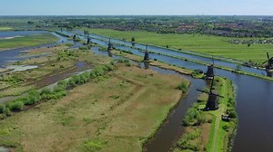Aerial view of Kinderdijk, picturesque rural landscape of iconic Dutch village with traditional windmills from 18th-century - South Holland, Netherlands, panorama of Europe from above