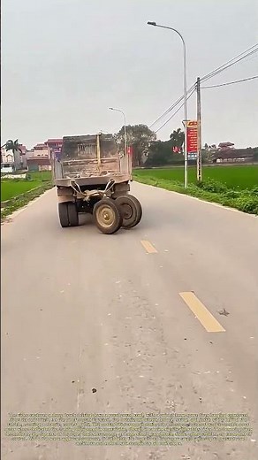 Towing Spare Tires: How a Dump Truck Hauls Loose Wheels Down a Rural Road