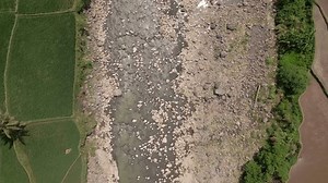 Overhead drone shot of Rivers dry up due to the dry season. Top down view. river with a rocky bottom