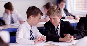 clip-18859571-4k-two-classmates-chatting-classroom-slow-motion