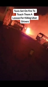 🚨BREAKING NEWS🚨 A taxi has been torched just meters from Maponya Mall, Soweto. Witnesses claim the driver was forcibly removed by a mob before the vehicle was set alight. This comes after last night’s violence, where an e-hailing driver was shot, killed, and his vehicle torched. #MaponyaMall #Soweto | Mash Mash