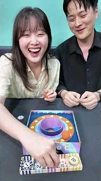 A game of chance: bounce the ball in, then decide whether to stop or double down for more points