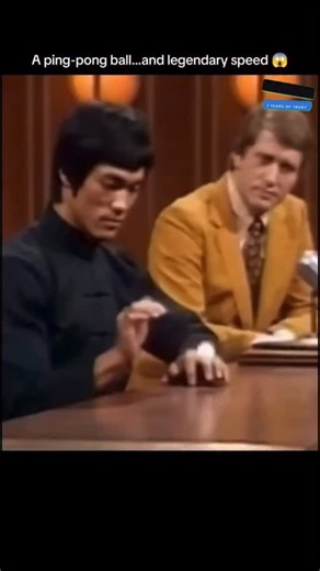 Innovation.09 on Instagram: "The post features a 15-second hyper-realistic martial arts clip inspired by Bruce Lee’s legendary speed and control. Styled like a 1970s television demonstration, the video shows a Bruce Lee-inspired Sora Al character turning a simple ping-pong ball into a serious test of reflexes, precision, and mastery. Every movement feels razor-sharp-fast strikes, perfect timing, and complete body control packed into just a few seconds. What makes the clip hit harder is the prese