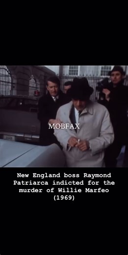 New England mob boss Raymond Patriarca tosses a cigarette at a news cameraman (1969)