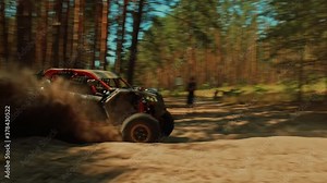 SLOW MOTION: Buggy car driving fast in cross country road. Fast rally auto is going with big clouds of dust. Speed riding of a racing off-road car in the forest road. Cinematic sport clip.